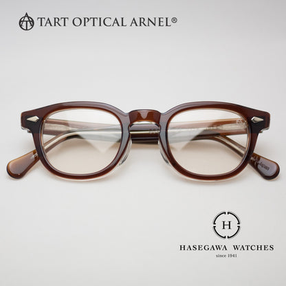 ウェリントン型メガネのタートオプティカルアーネルJD-04 ブラウンクリアの正面写真