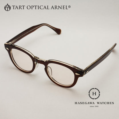 表がブラウン、裏がクリアの異なるカラーを張り合わせたブラウンクリアのメガネ写真